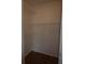 Walk-in closet with wire shelving and laminate flooring at 1075 S Hiawassee Rd # 916, Orlando, FL 32835