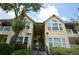 Inviting multi-story condo building with manicured landscaping and well-maintained facade at 1075 S Hiawassee Rd # 916, Orlando, FL 32835