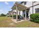 Relaxing brick-paved patio with pergola and grill, perfect for outdoor entertaining at 1350 Royal St George Blvd, Davenport, FL 33896