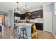 Contemporary kitchen with stainless steel appliances, sleek dark cabinets, and a breakfast bar at 1350 Royal St George Blvd, Davenport, FL 33896