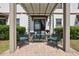 Cozy patio with brick pavers, pergola, and comfortable outdoor seating, great for relaxing at 1350 Royal St George Blvd, Davenport, FL 33896