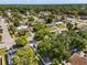 Overhead view of a neighborhood featuring tree-lined streets and an assortment of well-kept homes at 1360 Springfield St, Kissimmee, FL 34744