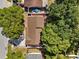 The home boasts a well-maintained roof and a lovely backyard, all viewed from above at 1360 Springfield St, Kissimmee, FL 34744
