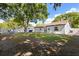 View of a spacious backyard with a well-maintained lawn and a durable fence at 1360 Springfield St, Kissimmee, FL 34744