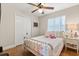 Comfortable bedroom with closet and cozy bed next to a window with curtains at 1360 Springfield St, Kissimmee, FL 34744