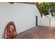 The exterior of this home showcases a lovely brick-paved area and a convenient water hose on a reel at 1360 Springfield St, Kissimmee, FL 34744
