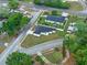 An aerial view of a modern home with a dark roof, nestled on a corner lot at 1440 Lake Shore Dr, Casselberry, FL 32707