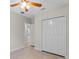 Bedroom with wood-look floors and a closet plus a doorway to another room visible at 1440 Lake Shore Dr, Casselberry, FL 32707
