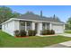 Well-maintained single Gathering home with mature landscaping, a garage and a paved driveway at 1440 Lake Shore Dr, Casselberry, FL 32707