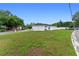 Spacious single-story home with a well-maintained lawn and a long driveway at 1440 Lake Shore Dr, Casselberry, FL 32707