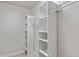 Walk-in closet featuring custom built in shelving, and ample storage at 1440 Lake Shore Dr, Casselberry, FL 32707