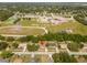 This elevated view highlights the home's proximity to local schools and greenery at 14796 Sw 39Th Cir, Ocala, FL 34473