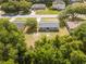 A back aerial view features a green lawn, small patio, and shed in a quiet neighborhood at 14796 Sw 39Th Cir, Ocala, FL 34473