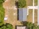 The property shows from above with a grey roof and compact yard space at 14796 Sw 39Th Cir, Ocala, FL 34473