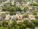 An aerial view shows the home's location in a lush, green neighborhood at 14796 Sw 39Th Cir, Ocala, FL 34473