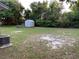Large backyard featuring an outbuilding for extra storage and mature trees for shade at 14796 Sw 39Th Cir, Ocala, FL 34473