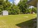 Large backyard with storage shed and abundant green space, perfect for outdoor activities and recreation at 14796 Sw 39Th Cir, Ocala, FL 34473