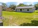 Spacious backyard featuring a well-maintained lawn, ideal for entertaining and outdoor enjoyment at 14796 Sw 39Th Cir, Ocala, FL 34473