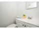 Bathroom featuring toilet, vanity with sink, and modern fixtures offers a clean aesthetic at 14796 Sw 39Th Cir, Ocala, FL 34473