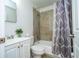 Bathroom featuring a bathtub with neutral tile surround, white vanity, and shower curtain at 14796 Sw 39Th Cir, Ocala, FL 34473
