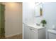 Bathroom featuring a sink with white vanity and doorway to hall at 14796 Sw 39Th Cir, Ocala, FL 34473