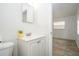 Bathroom with vanity, sink, mirror, and easy access from an adjacent bedroom at 14796 Sw 39Th Cir, Ocala, FL 34473