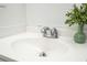 Clean bathroom sink with chrome faucet and decorative plant provides a modern touch at 14796 Sw 39Th Cir, Ocala, FL 34473