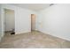 Bedroom with tile floors, bathroom entrance, second door, and neutral walls provides ample space at 14796 Sw 39Th Cir, Ocala, FL 34473