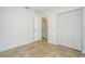 Simple bedroom with tile flooring and a closet offering functional space and storage at 14796 Sw 39Th Cir, Ocala, FL 34473