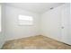 Bright bedroom featuring tile flooring, a window, and neutral walls at 14796 Sw 39Th Cir, Ocala, FL 34473