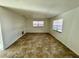 Bedroom with ceramic tile flooring, two windows providing natural light and neutral paint at 14796 Sw 39Th Cir, Ocala, FL 34473