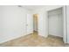 Bright bedroom featuring tile flooring, a closet, and neutral walls at 14796 Sw 39Th Cir, Ocala, FL 34473