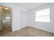 Bright bedroom with tile flooring, closet, and a window providing natural light at 14796 Sw 39Th Cir, Ocala, FL 34473