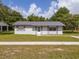 Charming single-story home with well-maintained lawn and gray shutters at 14796 Sw 39Th Cir, Ocala, FL 34473