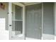 Inviting front door entrance showcasing a screen door and a traditional door with hardware at 14796 Sw 39Th Cir, Ocala, FL 34473