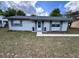 Charming single-story home featuring a well-maintained front yard and a welcoming entrance, enhancing its curb appeal at 14796 Sw 39Th Cir, Ocala, FL 34473