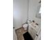 Well-lit half bathroom with a modern vanity and neutral tile flooring at 14796 Sw 39Th Cir, Ocala, FL 34473