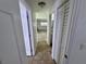 Hallway featuring ceramic tile flooring and convenient access to the bathroom, bedrooms and living area at 14796 Sw 39Th Cir, Ocala, FL 34473
