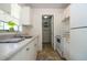 Well-lit kitchen with white appliances and ample cabinet space at 14796 Sw 39Th Cir, Ocala, FL 34473