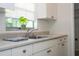 The kitchen features bright lighting, a window, and ample counter space at 14796 Sw 39Th Cir, Ocala, FL 34473