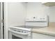 The kitchen features a smooth cooktop and neutral countertop at 14796 Sw 39Th Cir, Ocala, FL 34473