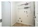Practical laundry room with shelving and hookups, located off the kitchen at 14796 Sw 39Th Cir, Ocala, FL 34473