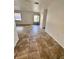 Spacious living room featuring ceramic tile flooring, neutral walls and ample natural light at 14796 Sw 39Th Cir, Ocala, FL 34473