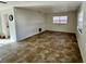 Open-concept living room with ceramic tile flooring and natural lighting, perfect for entertaining at 14796 Sw 39Th Cir, Ocala, FL 34473