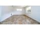 Neutral, tile-floored living room with two windows providing ample natural light at 14796 Sw 39Th Cir, Ocala, FL 34473
