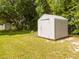 Close-up of a storage shed in a spacious, well-maintained backyard, offering ample storage solutions at 14796 Sw 39Th Cir, Ocala, FL 34473