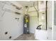 Utility room with modern water heater, HVAC system, and shelving at 14796 Sw 39Th Cir, Ocala, FL 34473