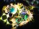 Nighttime aerial view of the community's resort-style pools, cabanas, and lush landscaping at 1491 Rolling Fairway Dr, Davenport, FL 33896