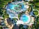 Overhead view of the community's resort-style pools, cabanas, and lush landscaping at 1491 Rolling Fairway Dr, Davenport, FL 33896