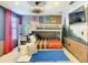 Themed bedroom with custom brick accent wall, flat screen TV, and bunk beds at 1491 Rolling Fairway Dr, Davenport, FL 33896